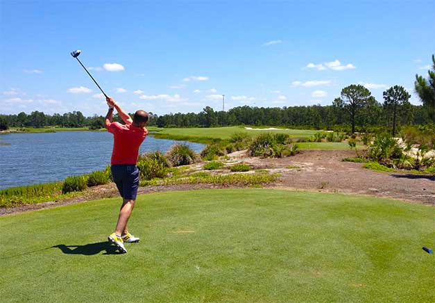 Stuart teeing off in Florida by a lake